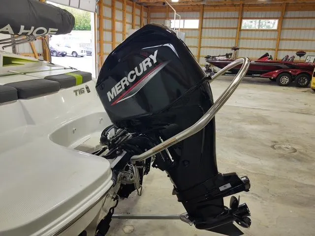 Slide: The Image of 2023 Tahoe T16 boat with Mercury outboard motor in a garage. - 4