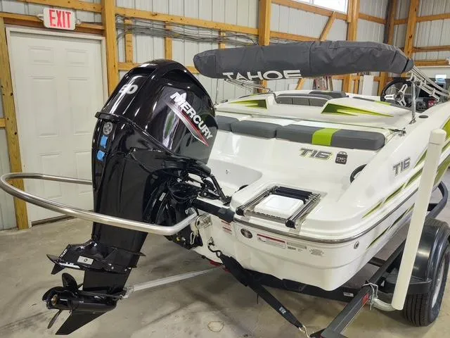 Slide: The Image of 2023 Tahoe T16 boat with Mercury engine in a garage setting. - 6
