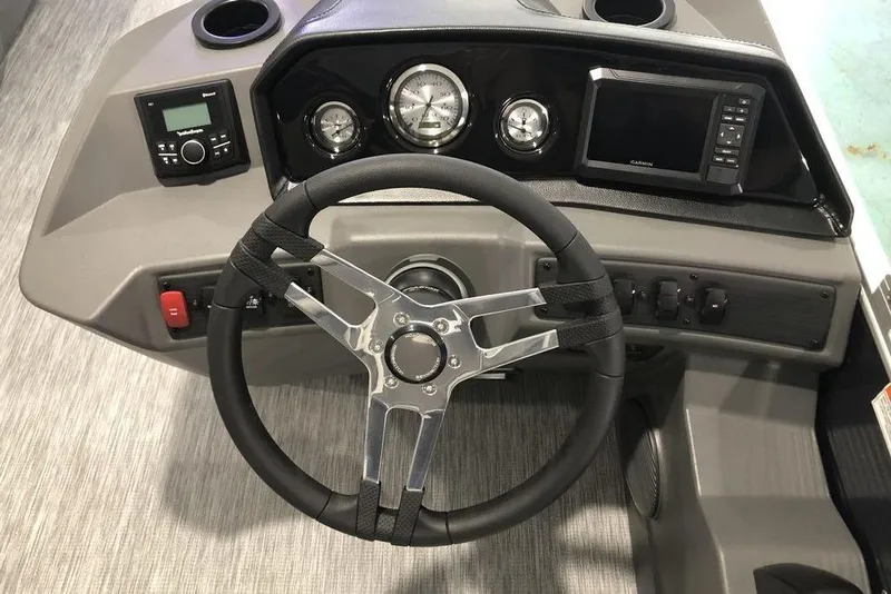 Slide: The Image of 2026 Bennington S Swingback 22 SSB SPS boat dashboard with steering wheel and controls. - 4