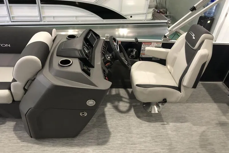 Slide: The Image of 2026 Bennington S Swingback 22 SSB SPS boat interior with helm and captain's chair. - 9