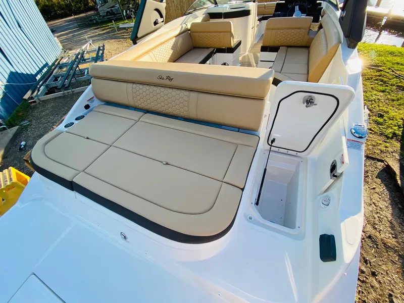 Slide: The Image of 2022 Sea Ray 270 SDX boat with spacious tan seating and sleek design. - 12