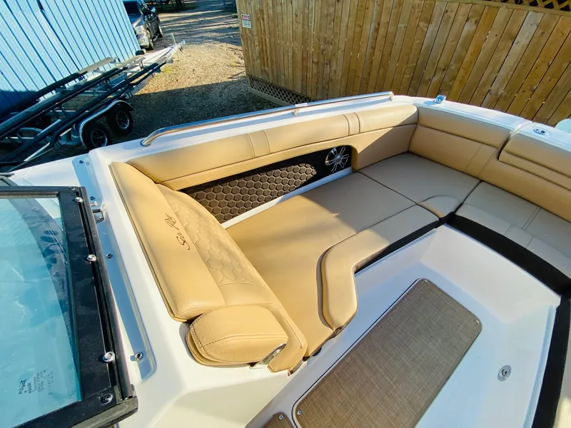 Slide: The Image of 2022 Sea Ray 270 SDX boat interior with tan seating and stylish design. - 23