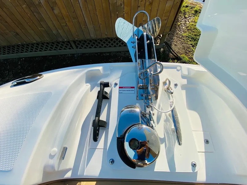Slide: The Image of 2022 Sea Ray 270 SDX boat anchor system on deck, featuring sleek chrome finish. - 24