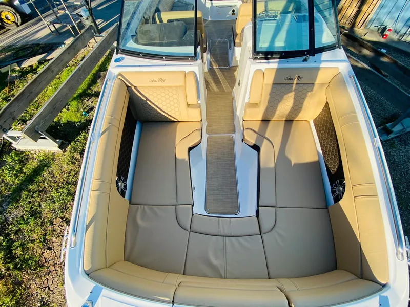 Slide: The Image of 2022 Sea Ray 270 SDX boat with spacious tan seating and sleek design. - 25