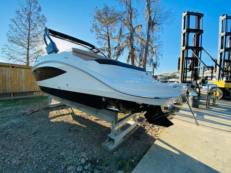 Slide: The Image of 2022 Sea Ray 270 SDX boat on display outdoors, showcasing sleek design and modern features. - 5