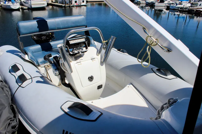 Slide: The Image of 1999 Bayliner 4788 Motoryacht with inflatable tender and Garmin navigation system at marina. - 21