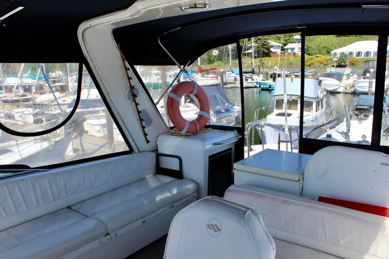 Slide: The Image of Interior view of 1999 Bayliner 4788 Motoryacht with marina background. - 30