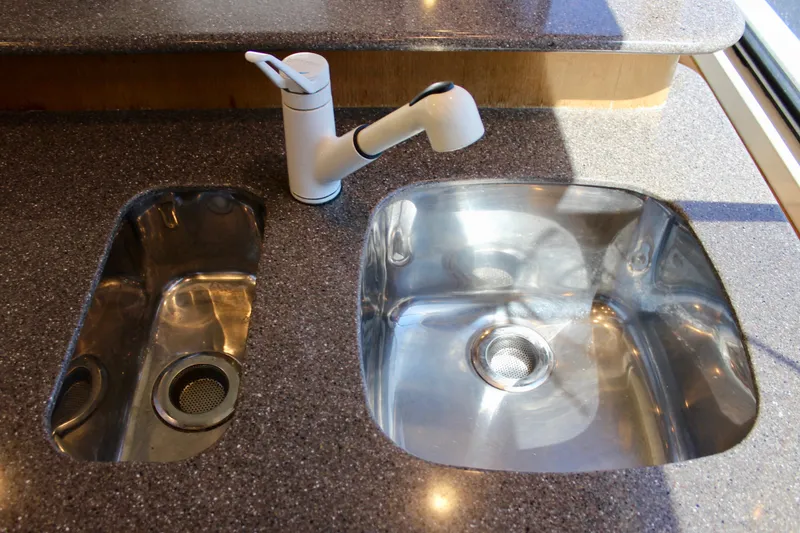 Slide: The Image of Modern kitchen sink and faucet on 1999 Bayliner 4788 Motoryacht. - 40
