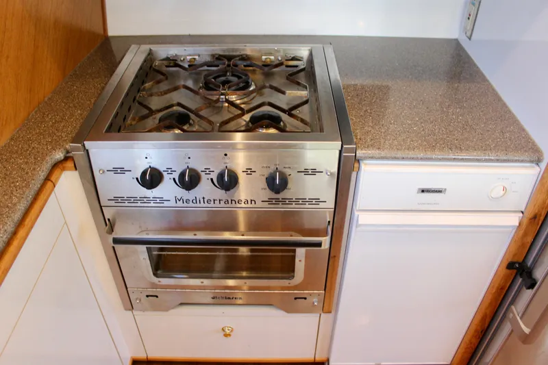 Slide: The Image of Stainless steel stove and dishwasher in 1999 Bayliner 4788 Motoryacht kitchen. - 42