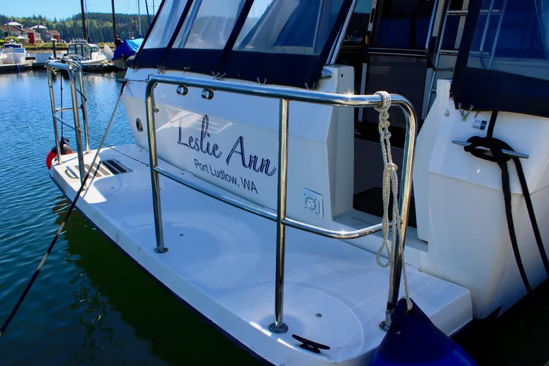 Slide: The Image of 1999 Bayliner 4788 Motoryacht docked, featuring "Leslie Ann" nameplate, Port Ludlow, WA. - 8