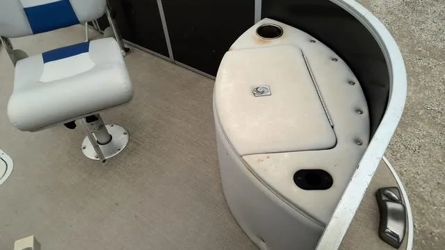 Slide: The Image of 2020 SunCatcher V322 F boat interior with seating and storage compartment. - 3