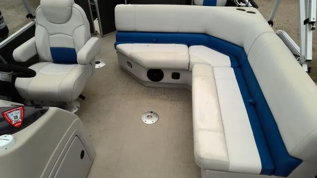 Slide: The Image of 2020 SunCatcher V322 F boat interior with white and blue seating arrangement. - 7