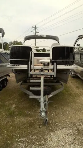 Slide: The Image of 2019 SunCatcher V20 F pontoon boat on trailer, parked outdoors. - 11