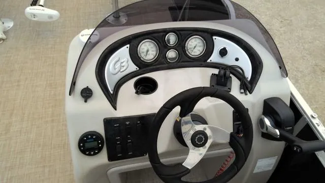 Slide: The Image of 2019 SunCatcher V20 F boat dashboard with steering wheel and gauges. - 3