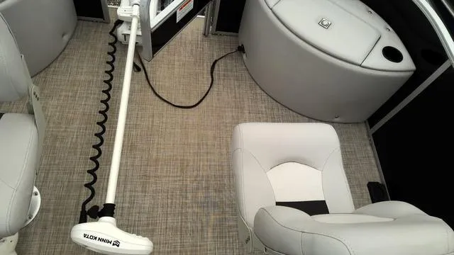 Slide: The Image of 2019 SunCatcher V20 F boat interior with seating and Minn Kota trolling motor. - 6