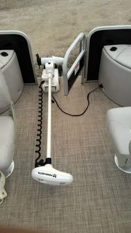 Slide: The Image of 2019 SunCatcher V20 F boat interior with trolling motor and seating. - 7