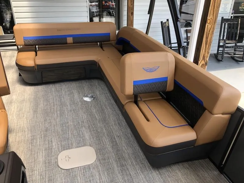 Slide: The Image of 2025 Bennington M L-Bench 24ML boat interior with tan and blue seating. - 7
