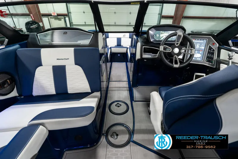 Slide: The Image of Interior of 2025 MasterCraft X24 boat with modern dashboard and seating. - 17