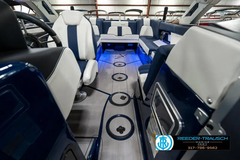 Slide: The Image of 2025 MasterCraft X24 boat interior with blue LED lighting and luxurious seating. - 20
