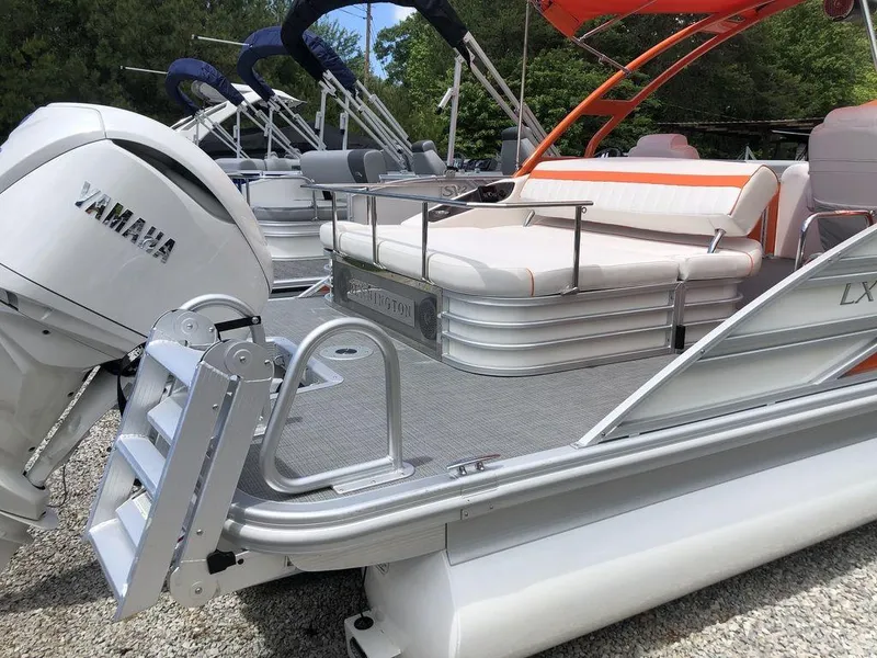 Slide: The Image of 2024 Bennington 24 LXSSBA pontoon boat with Yamaha engine, featuring sleek design and comfortable seating. - 7