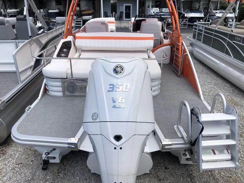 Slide: The Image of 2024 Bennington 24 LXSSBA pontoon boat with Yamaha 350 V6 engine, docked. - 8