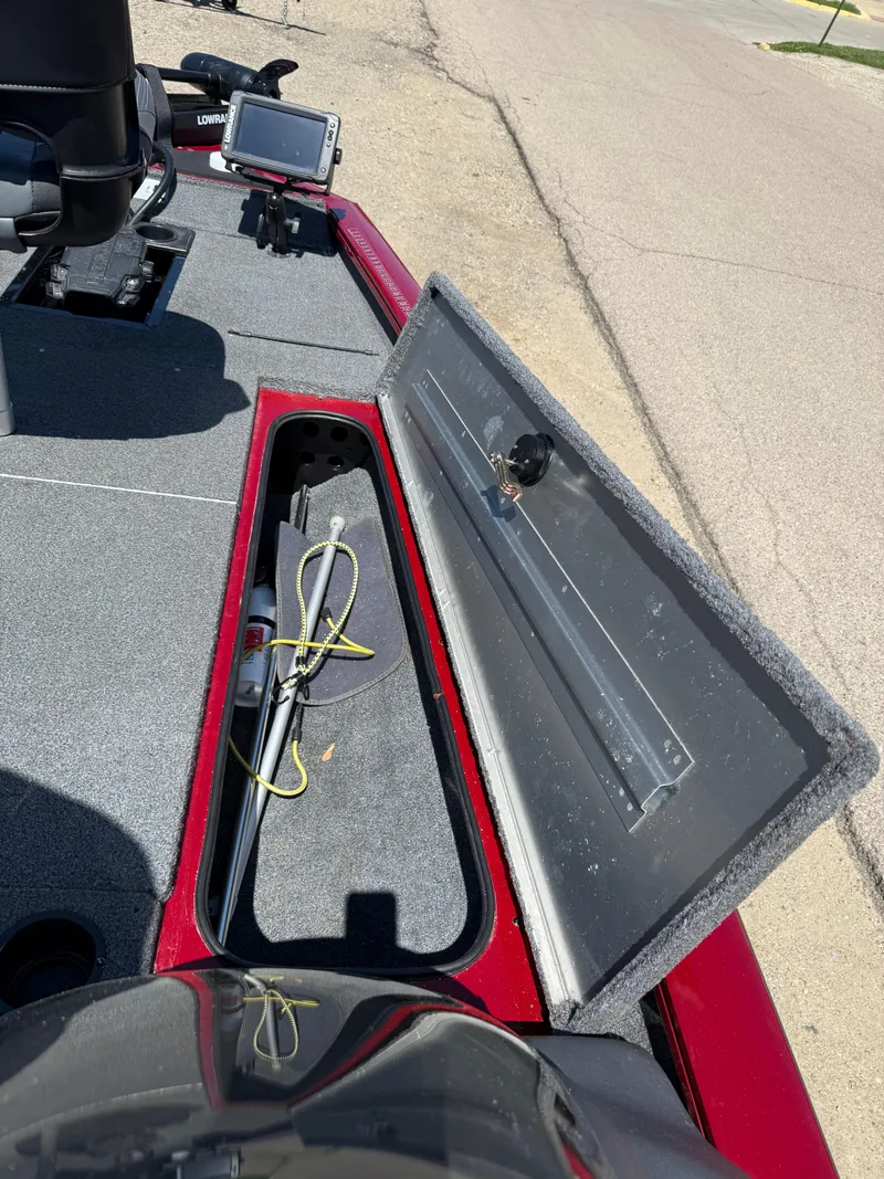 Slide: The Image of 2019 Tracker Pro Team 175 TXW boat with open storage compartment and mounted electronics. - 15