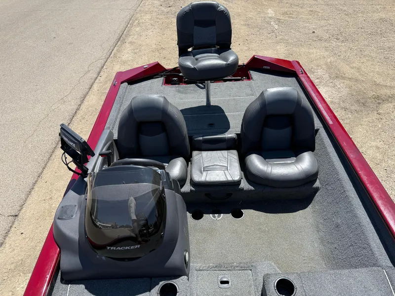 Slide: The Image of 2019 Tracker Pro Team 175 TXW boat interior with seating and control panel. - 16