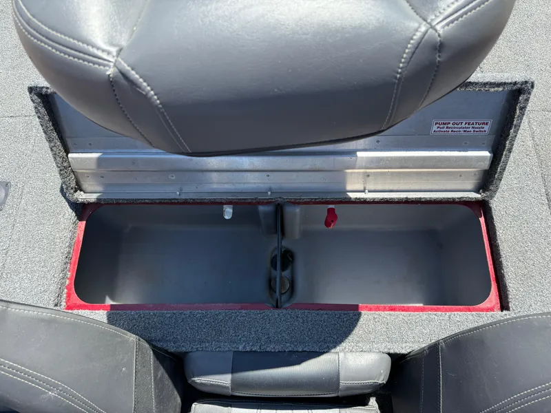 Slide: The Image of 2019 Tracker Pro Team 175 TXW boat storage compartment with open lid and seating. - 19