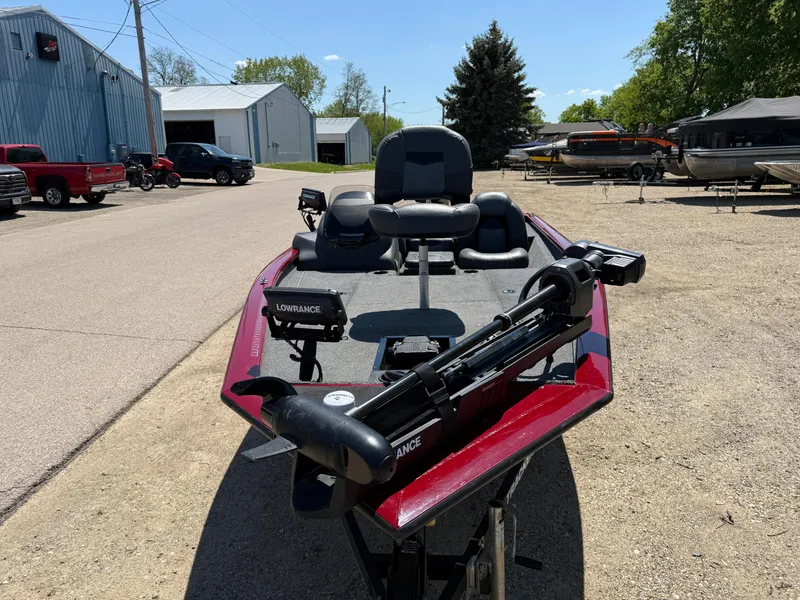 Slide: The Image of 2019 Tracker Pro Team 175 TXW boat with fishing gear, parked outdoors. - 2