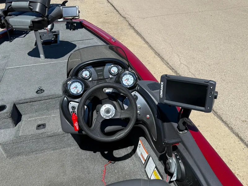 Slide: The Image of 2019 Tracker Pro Team 175 TXW boat dashboard with steering wheel and navigation system. - 22