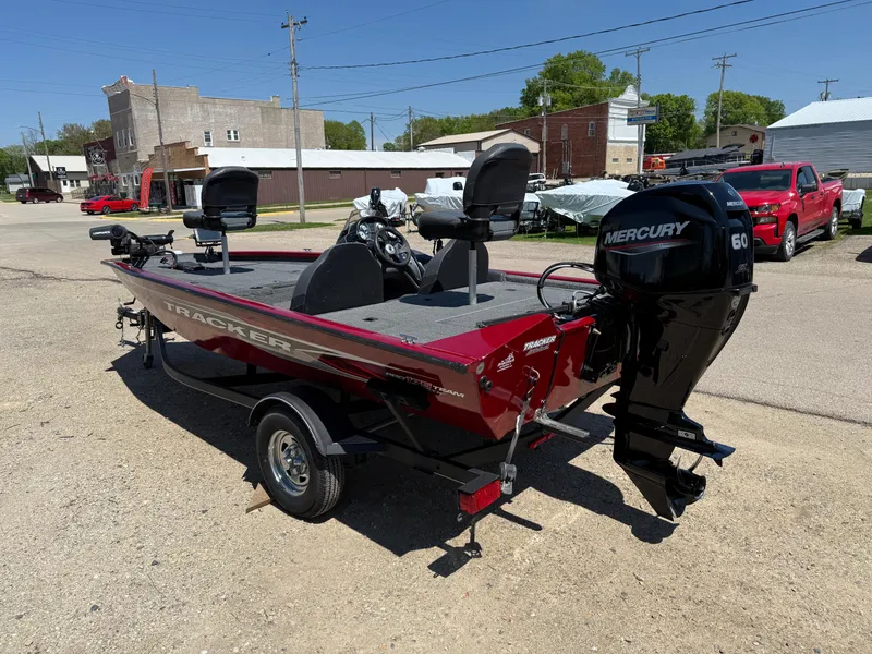 Slide: The Image of 2019 Tracker Pro Team 175 TXW boat with Mercury 60 engine, parked outdoors. - 5