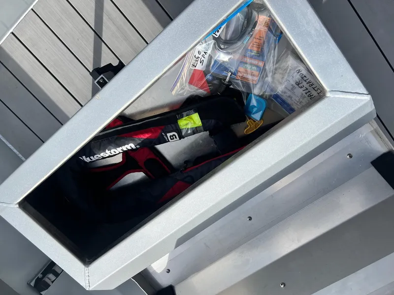 Slide: The Image of Storage compartment on Hanko 185 CCLS boat, containing safety gear and accessories, 2022 model. - 8