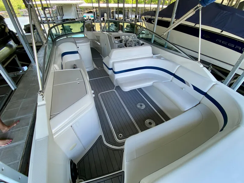 Slide: The Image of 2000 Formula 280 Bowrider boat interior with spacious seating and modern dashboard. - 10