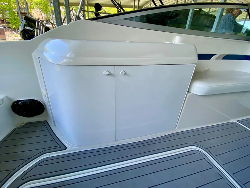 Slide: The Image of 2000 Formula 280 Bowrider interior with sleek white cabinetry and modern design elements. - 11