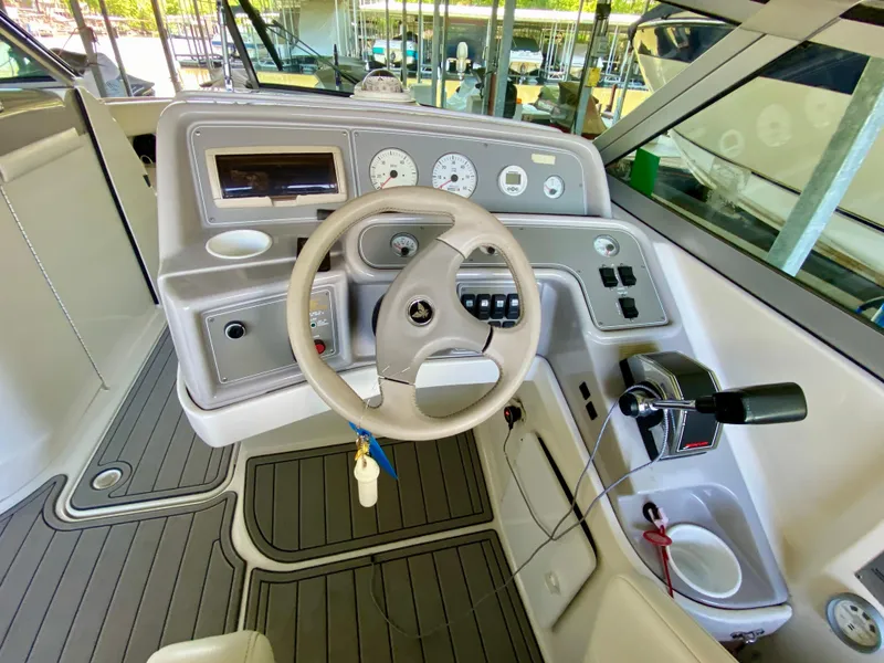 Slide: The Image of Interior cockpit of a 2000 Formula 280 Bowrider boat with steering wheel and controls. - 17