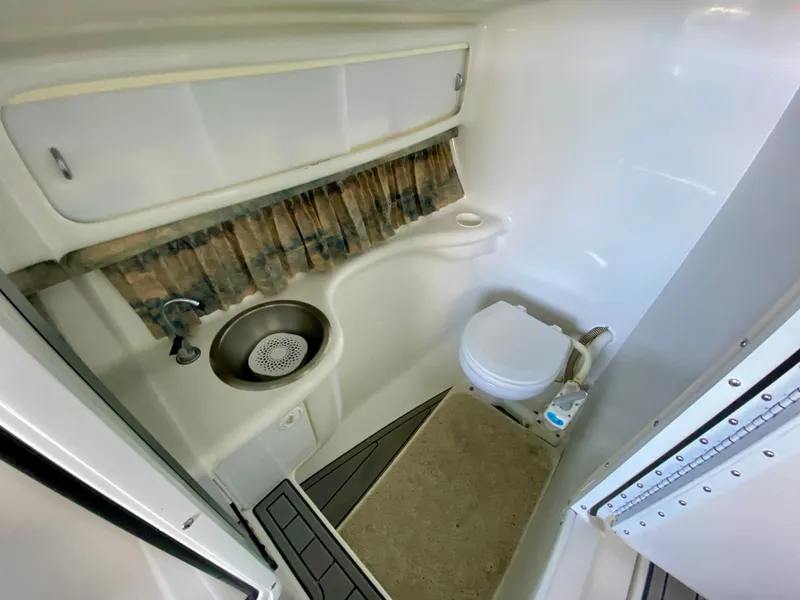 Slide: The Image of 2000 Formula 280 Bowrider boat bathroom with sink and toilet. - 21