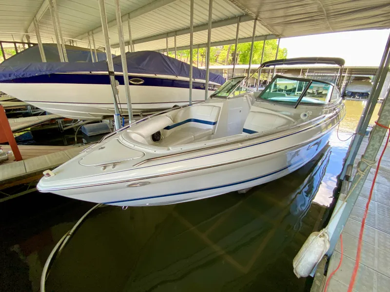 Slide: The Image of 2000 Formula 280 Bowrider boat docked under covered marina. - 3