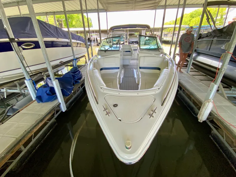 Slide: The Image of 2000 Formula 280 Bowrider docked in a marina, front view. - 4