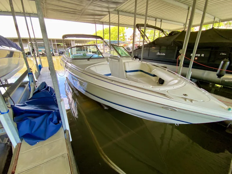 Slide: The Image of 2000 Formula 280 Bowrider docked in a covered marina slip. - 5