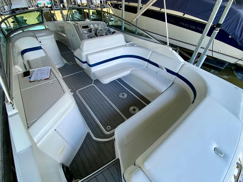 Slide: The Image of 2000 Formula 280 Bowrider boat interior with white seating and modern dashboard. - 8