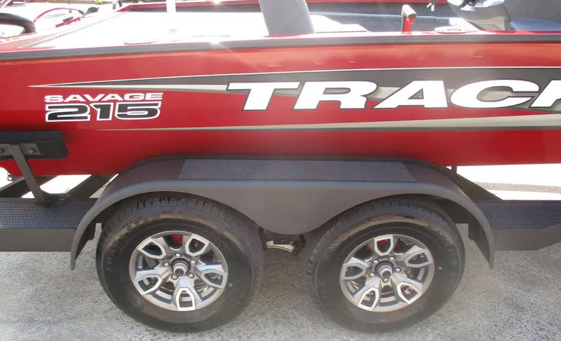 Slide: The Image of 2025 Tracker SAVAGE™ 215 boat trailer with dual wheels and red exterior. - 10