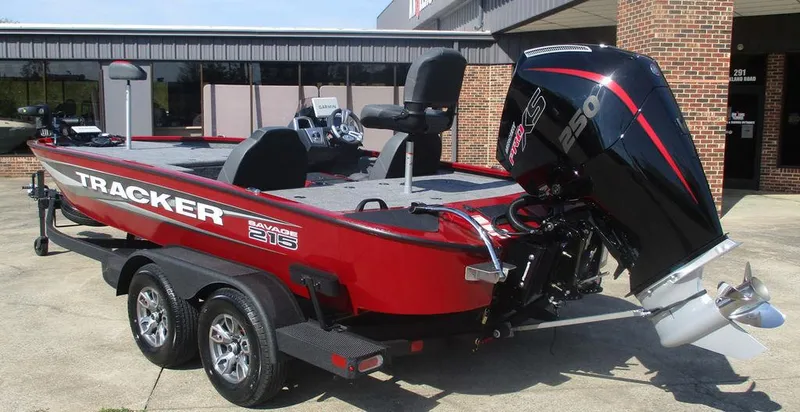 Slide: The Image of 2025 Tracker SAVAGE™ 215 boat, red, on trailer, with powerful outboard motor. - 3
