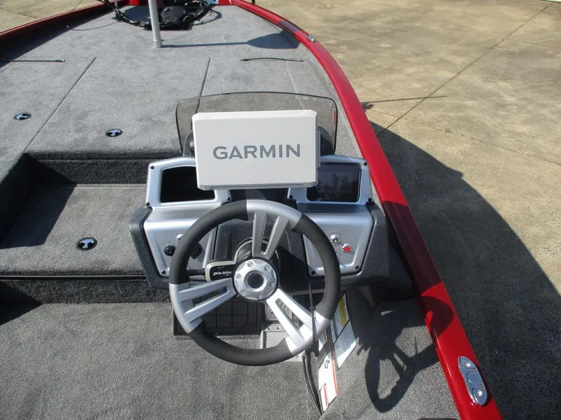 Slide: The Image of 2025 Tracker SAVAGE™ 215 boat dashboard with Garmin navigation system and steering wheel. - 5