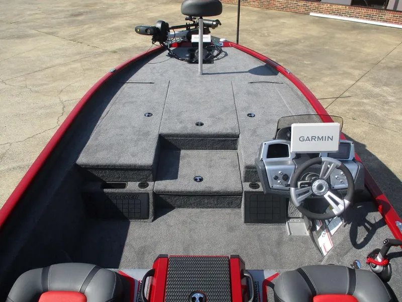 Slide: The Image of 2025 Tracker SAVAGE™ 215 boat interior with Garmin navigation system and seating. - 6