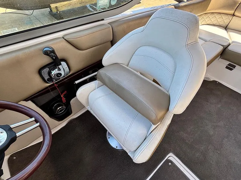 Slide: The Image of 2010 Regal 2300 RX Bowrider interior with captain's chair and control panel. - 10