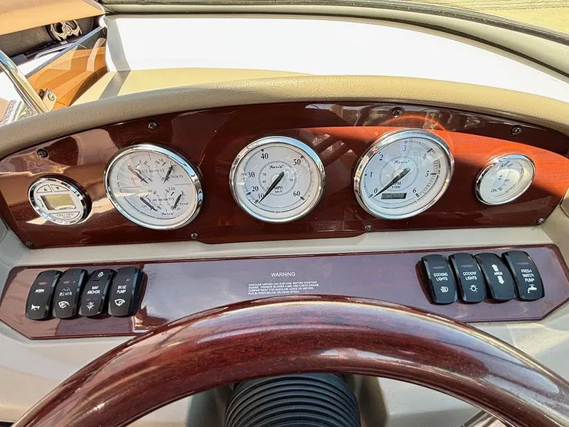 Slide: The Image of Dashboard of a 2010 Regal 2300 RX Bowrider with gauges and controls. - 11