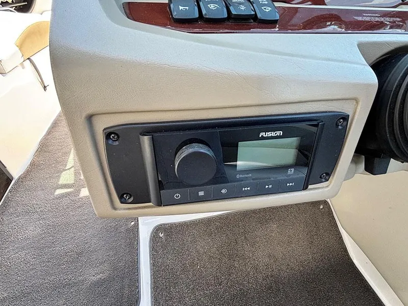 Slide: The Image of Fusion stereo system on 2010 Regal 2300 RX Bowrider boat dashboard. - 12