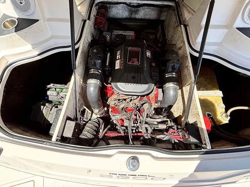 Slide: The Image of 2010 Regal 2300 RX Bowrider engine compartment with visible components and wiring. - 15