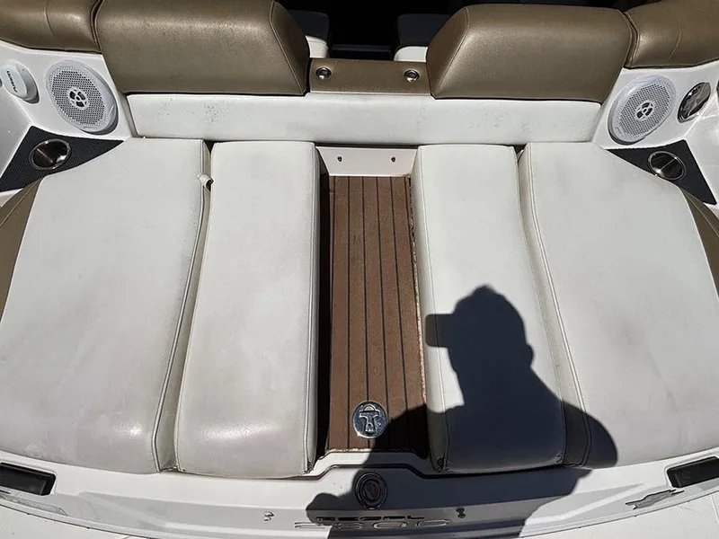 Slide: The Image of 2010 Regal 2300 RX Bowrider interior with white seating and brown accents. - 6