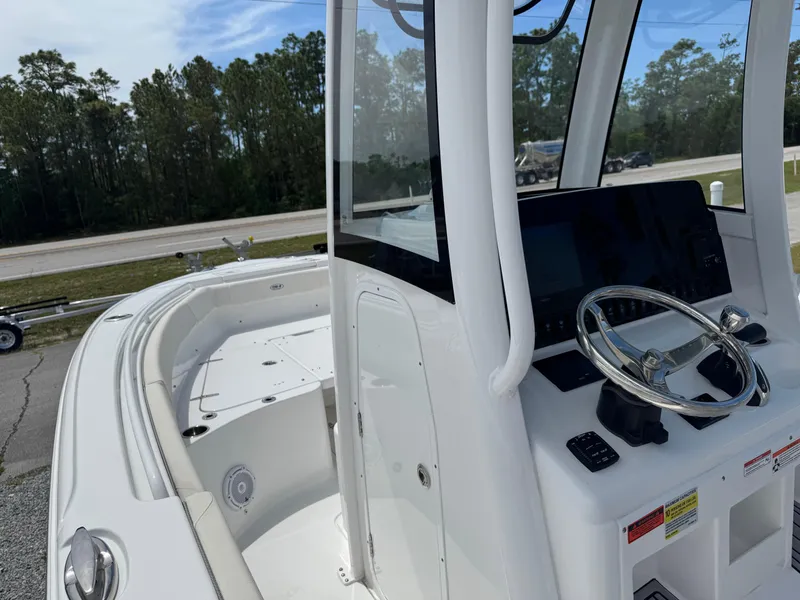Slide: The Image of 2023 Sea Hunt Ultra 255 SE boat interior with steering wheel and dashboard. - 10